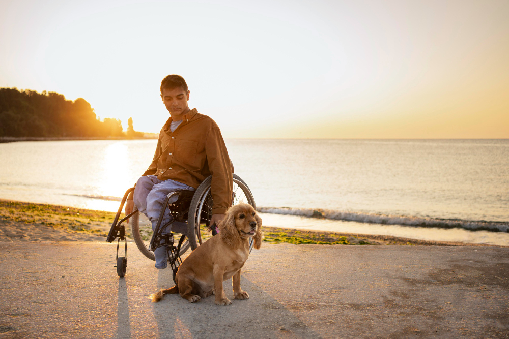Image of disabled man in a wheelchair with dog. https://www.freepik.com/search?ai=excluded&format=search&last_filter=query&last_value=disabled+person+with+pet&query=disabled+person+with+pet&type=photo
